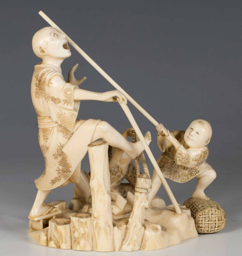 HUMEROUS JAPANESE IVORY OKIMONO GROUP SIGNED GYOKUSUI View III