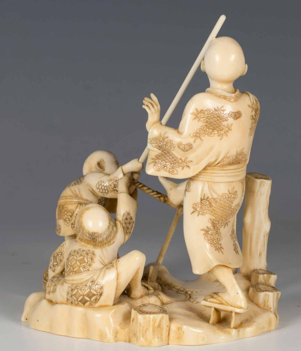 HUMEROUS JAPANESE IVORY OKIMONO GROUP SIGNED GYOKUSUI View VI