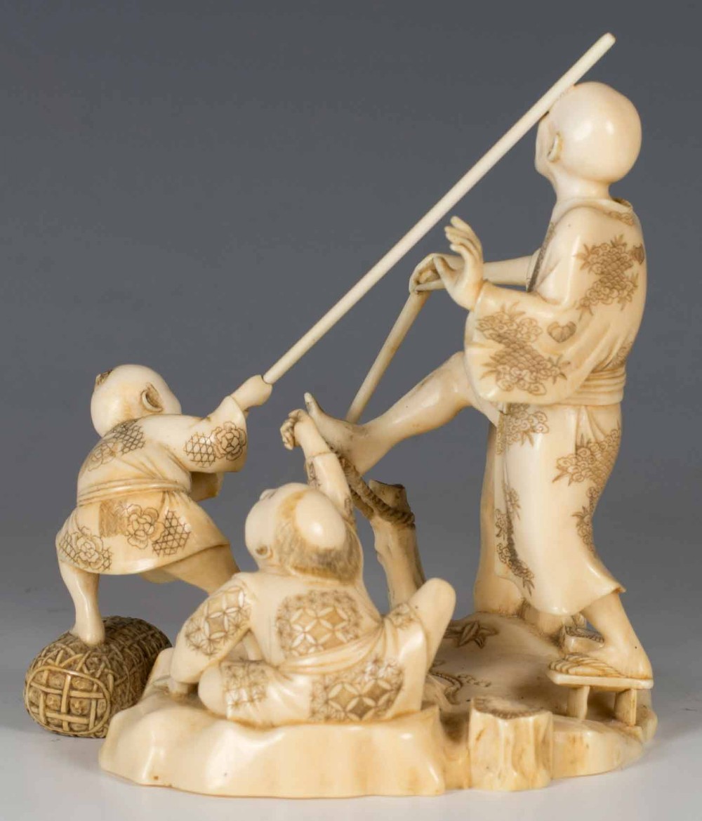HUMEROUS JAPANESE IVORY OKIMONO GROUP SIGNED GYOKUSUI View VII