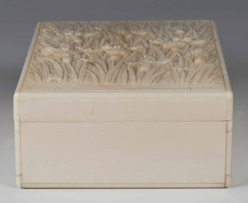 A FINELY CARVED JAPANESE IVORY LIDDED BOX BY KIYOCHIKA View V
