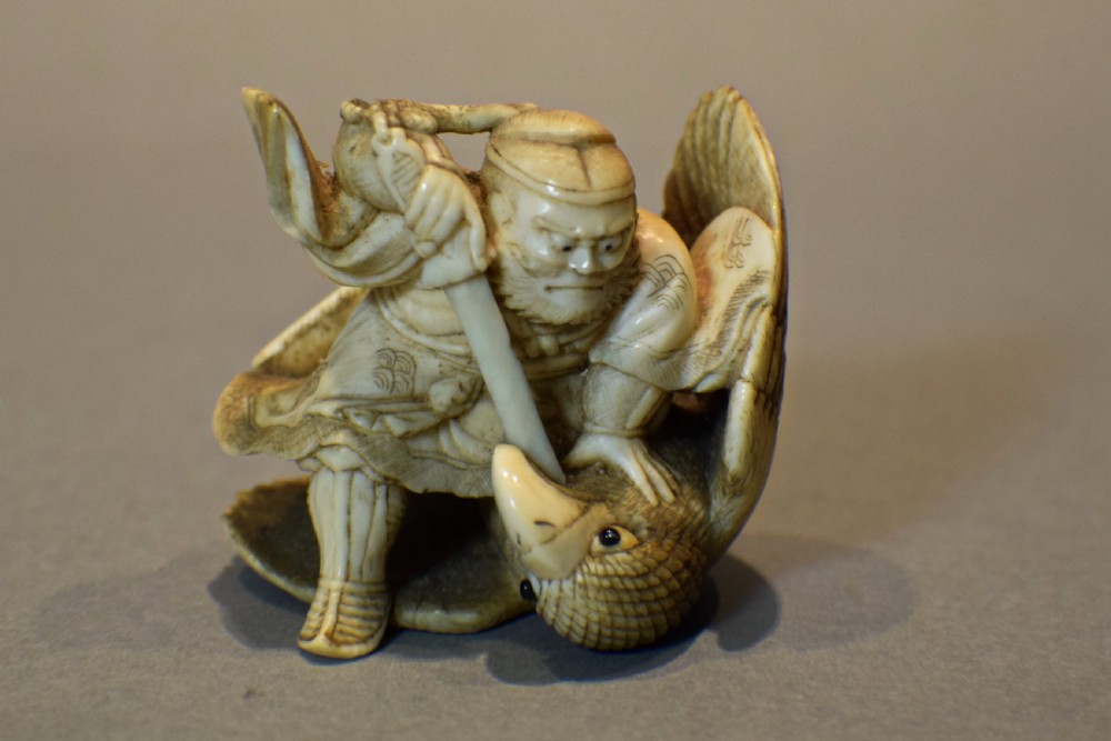 JAPANESE IVORY OKIMONO OF SAMURAI INO HAYATA SLAYING THE GIANT BIRD View VIII