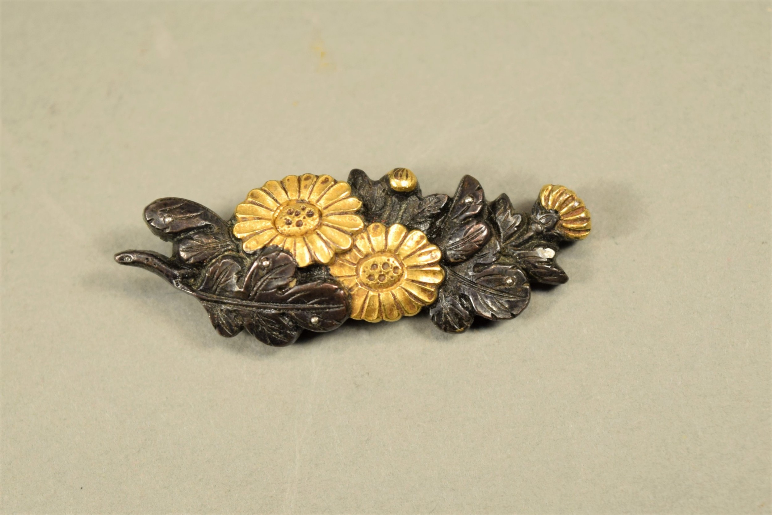 NICE QUALITY PAIR OF JAPANESE MIXED METAL MENUKI - FLOWERS View II