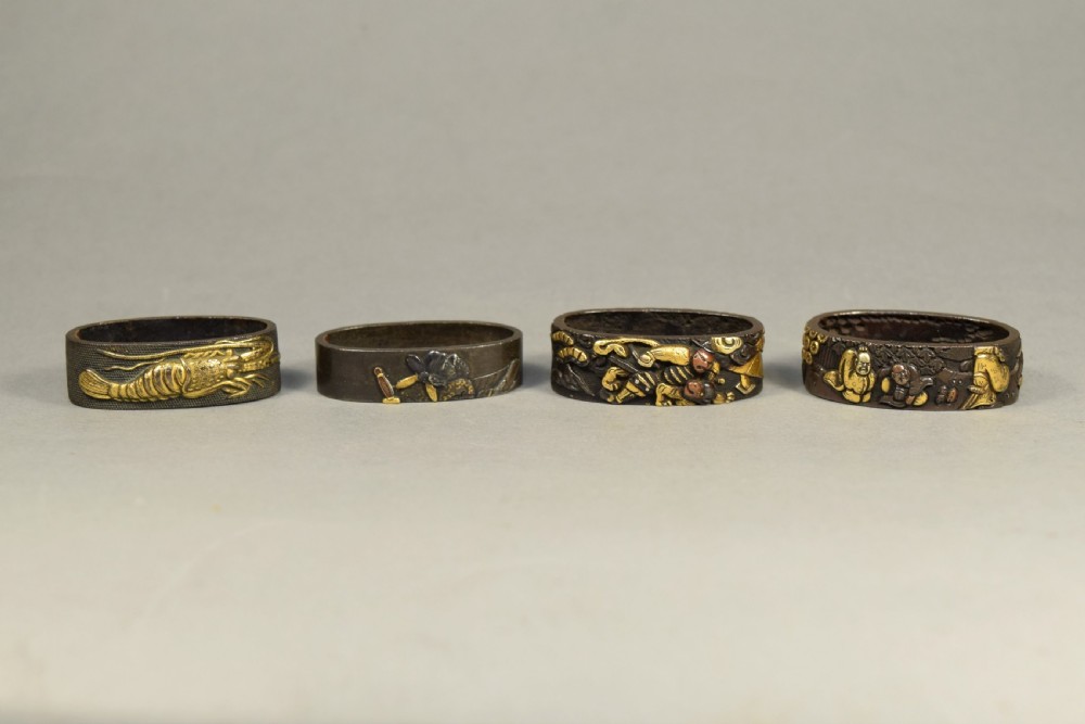 A NICE GROUP OF JAPANESE EDO PERIOD MIXED METAL FUCHI (SWORD FITTINGS)