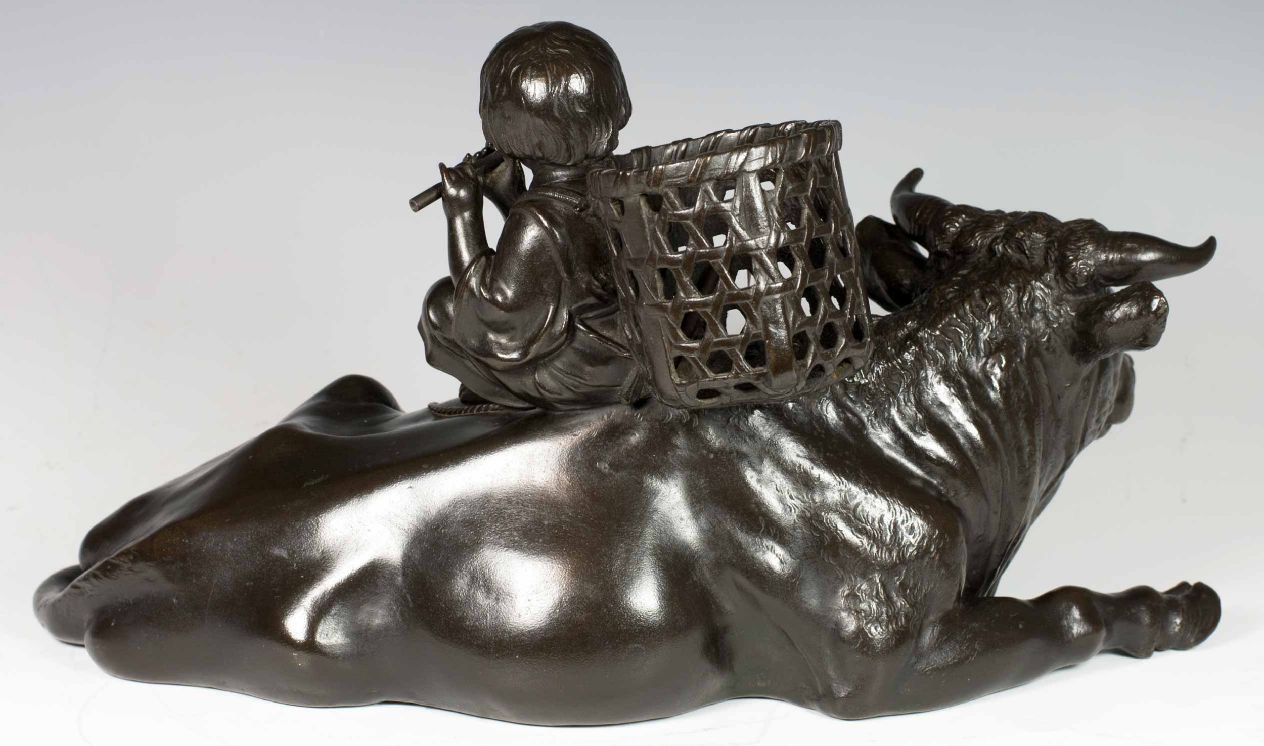 A FINE QUALITY SIGNED JAPANESE BRONZE OKIMONO BOY UPON AN OXEN View V