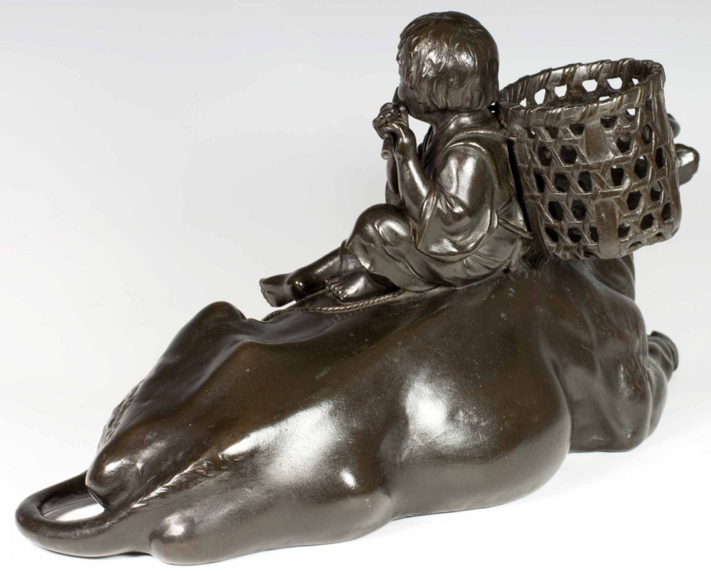 A FINE QUALITY SIGNED JAPANESE BRONZE OKIMONO BOY UPON AN OXEN View VI