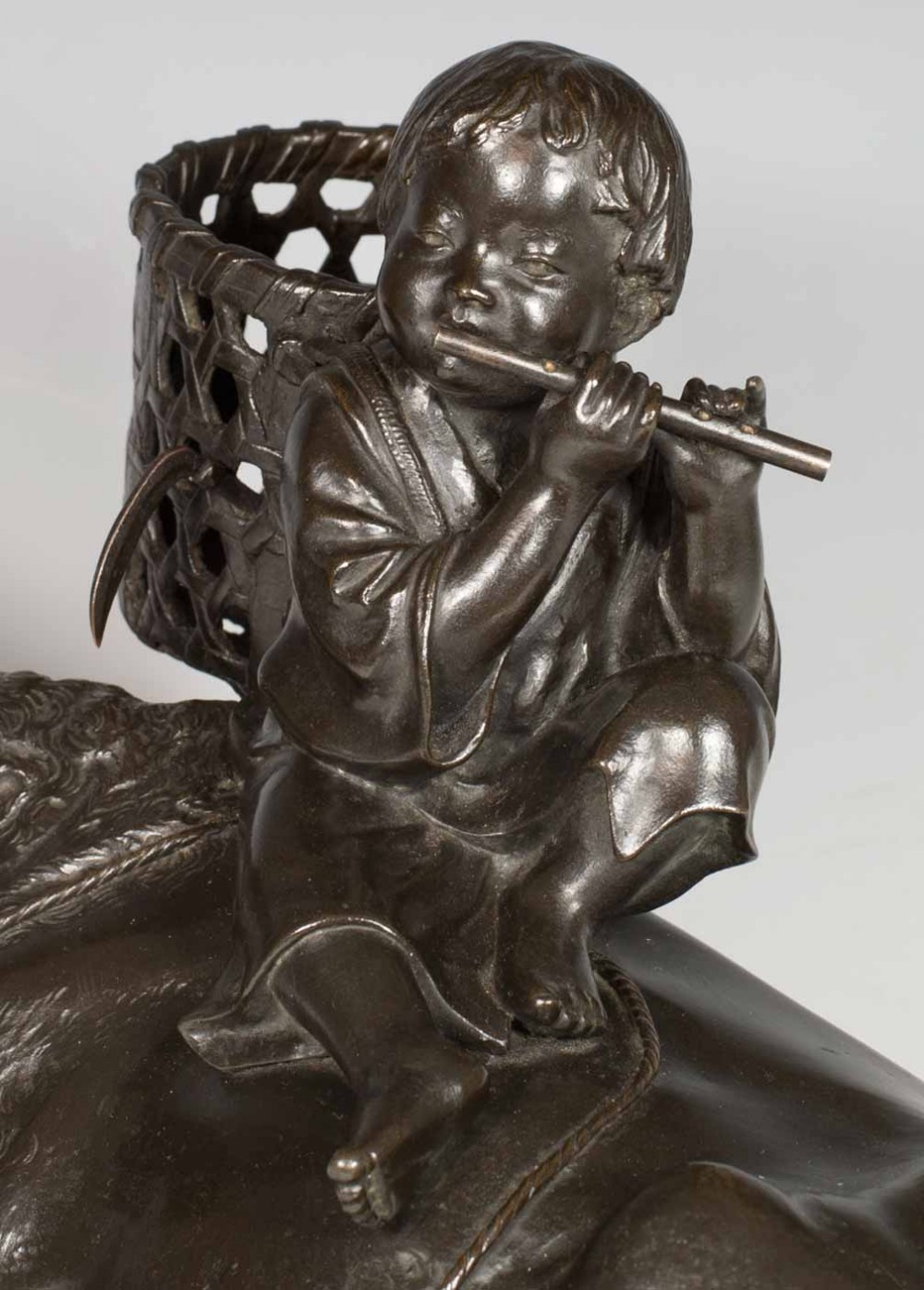 A FINE QUALITY SIGNED JAPANESE BRONZE OKIMONO BOY UPON AN OXEN View IX