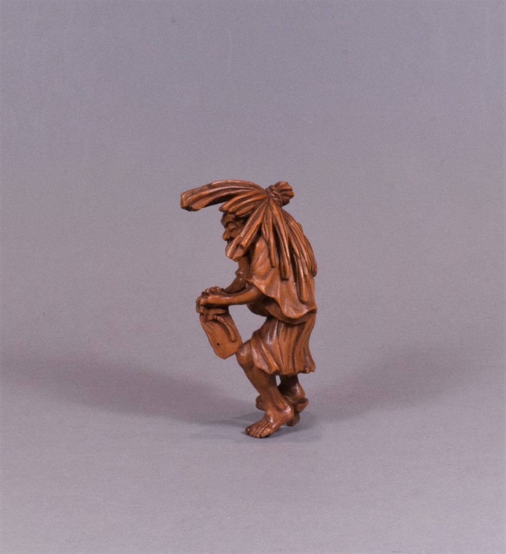 A WELL CARVED JAPANESE CARVED WOODEN NETSUKE - ABURA BOZU - THE OIL THIEF View VI