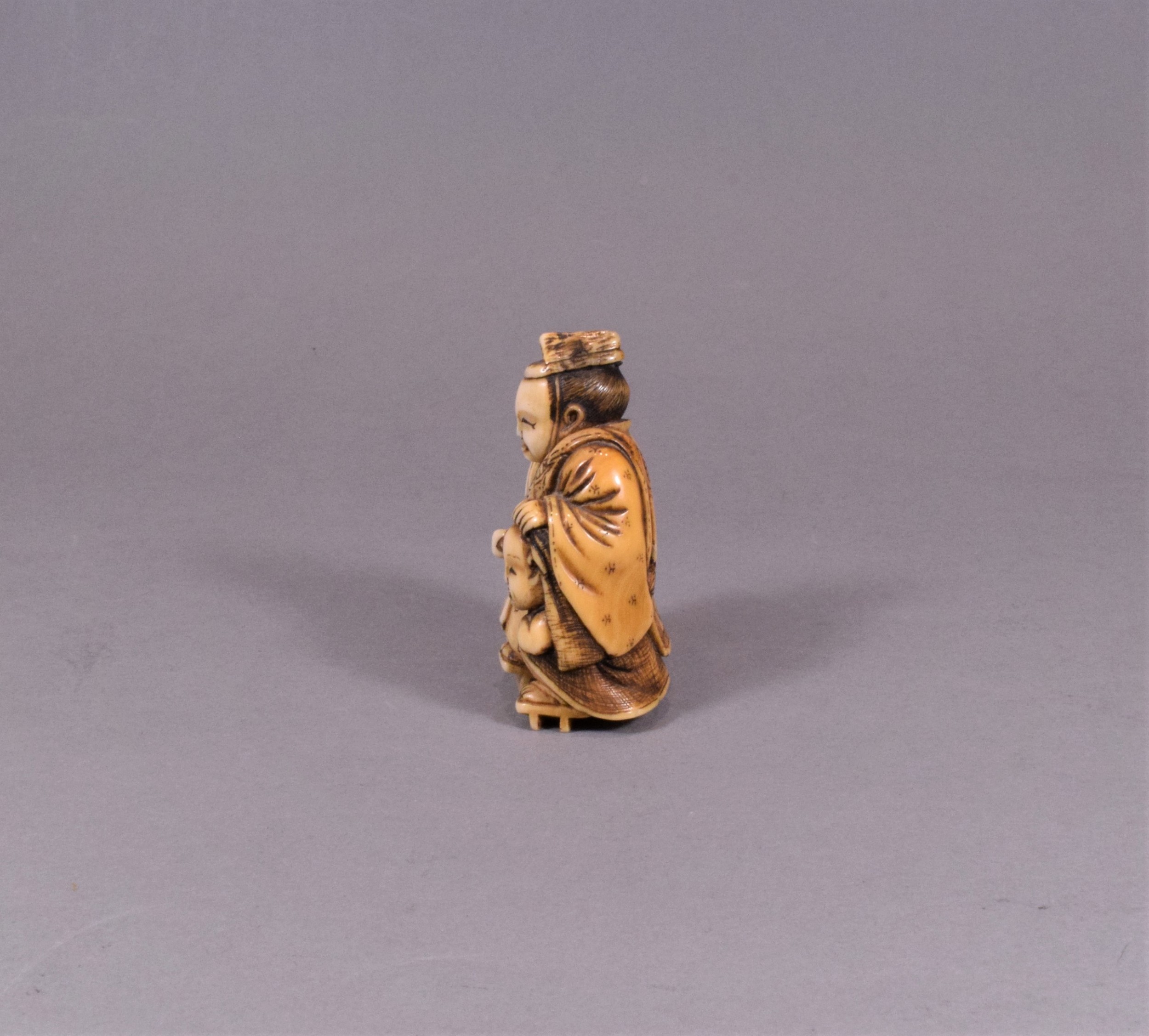 JAPANESE MEIJI PERIOD CARVED IVORY NETSUKE - TADAMORI AND THE OIL THIEF View II