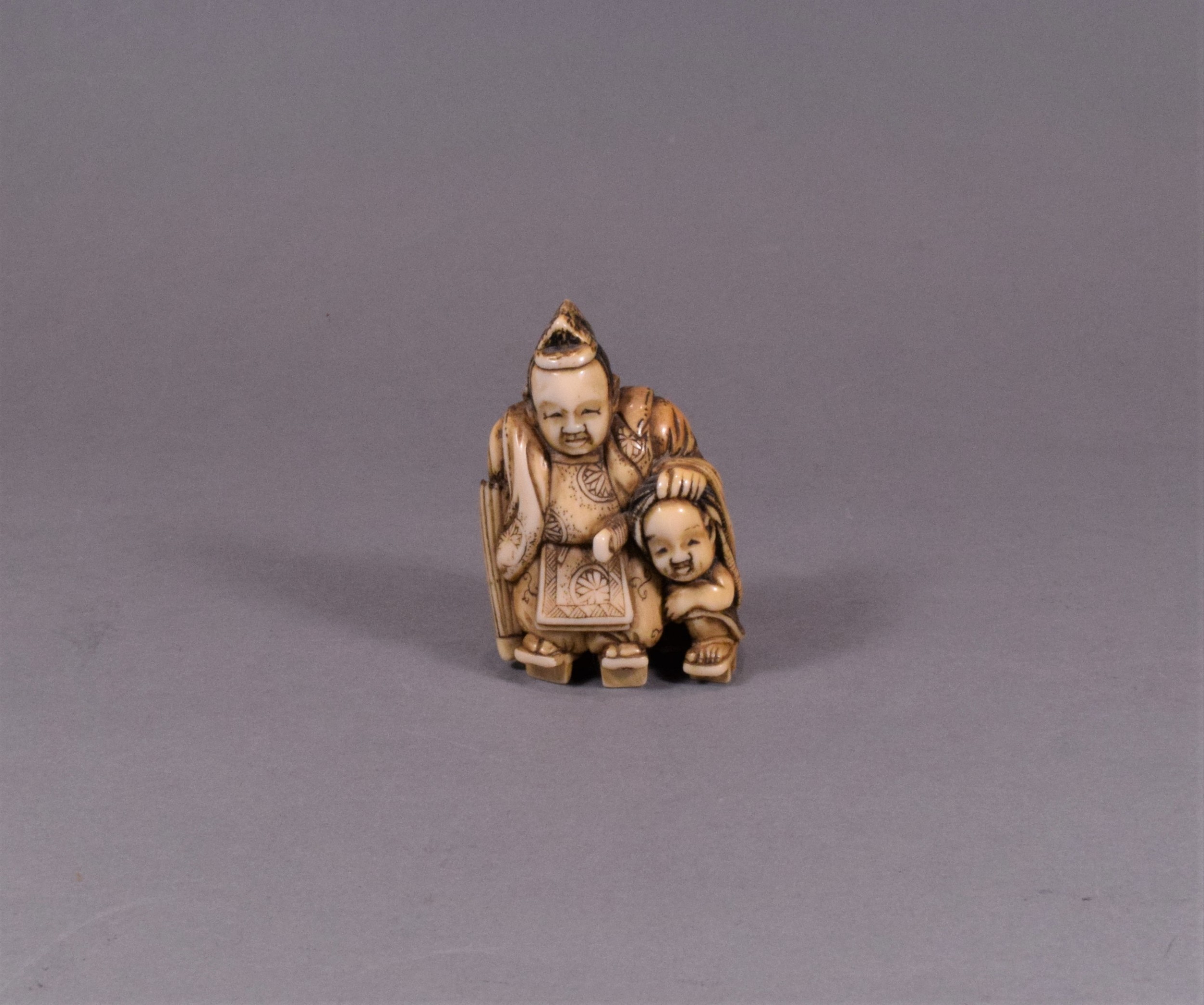 JAPANESE MEIJI PERIOD CARVED IVORY NETSUKE - TADAMORI AND THE OIL THIEF View III
