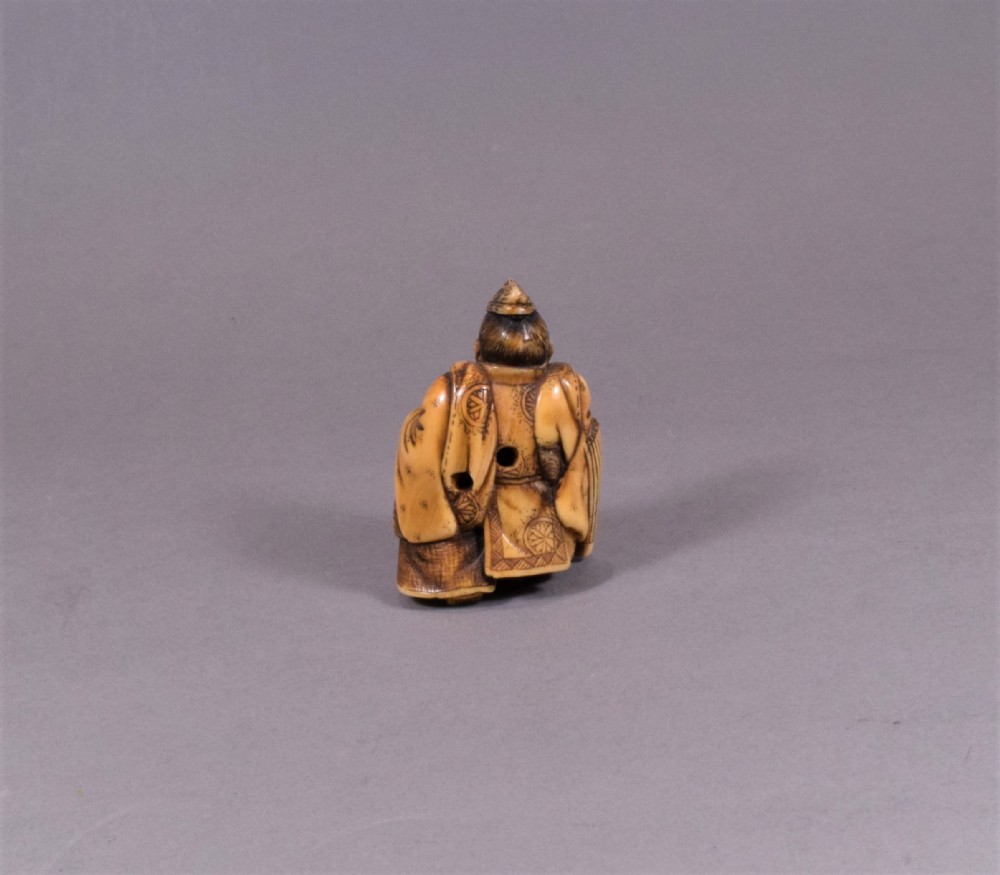 JAPANESE MEIJI PERIOD CARVED IVORY NETSUKE - TADAMORI AND THE OIL THIEF View IV
