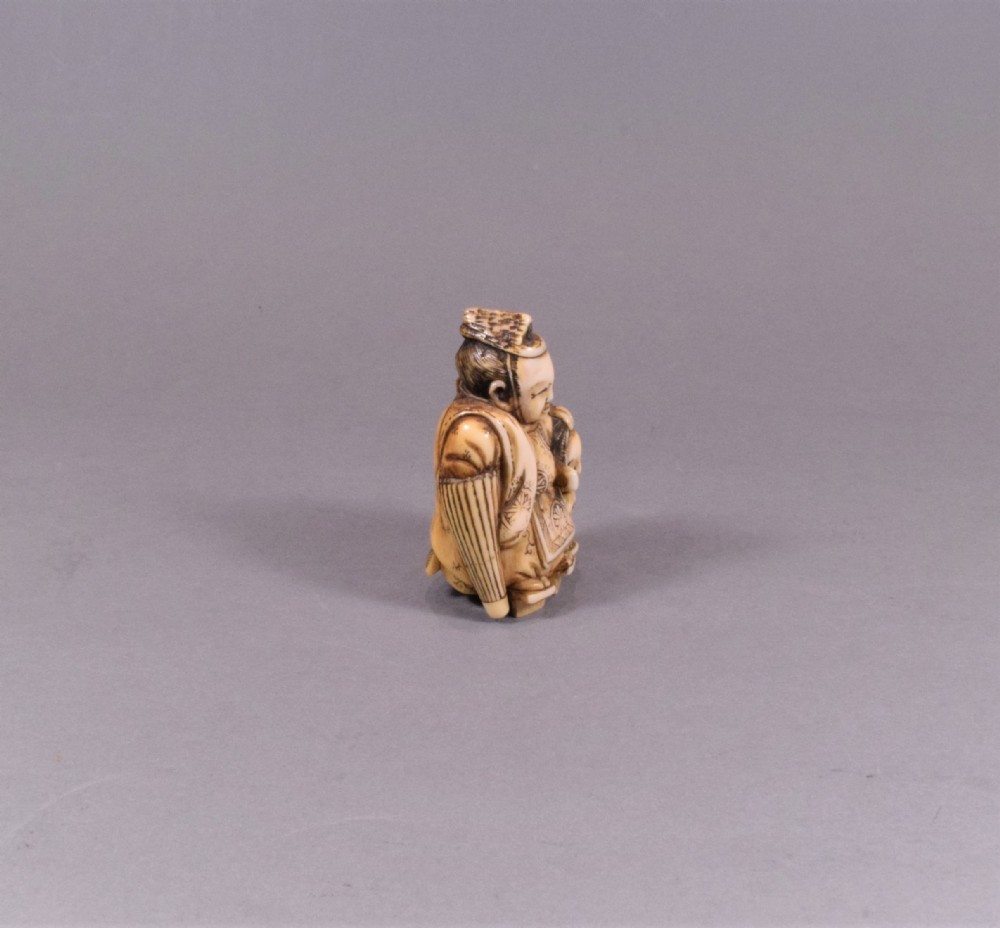 JAPANESE MEIJI PERIOD CARVED IVORY NETSUKE - TADAMORI AND THE OIL THIEF View VI