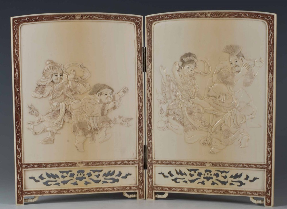 A DELIGHTFUL JAPANESE IVORY TWO FOLD TABLE SCREEN