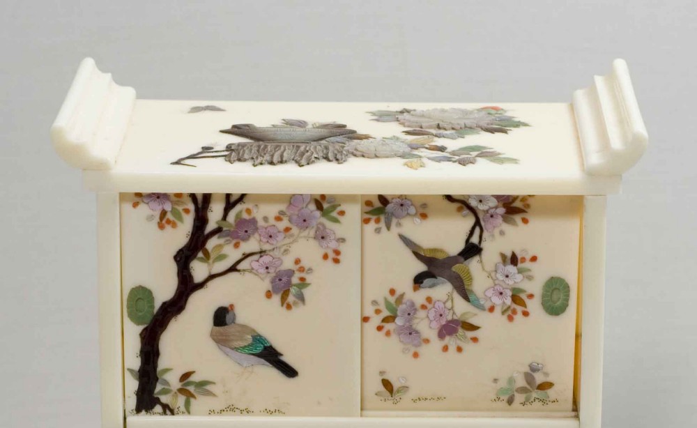 A MINIATURE JAPANESE IVORY AND SHIBAYAMA TABLE CABINET View XII