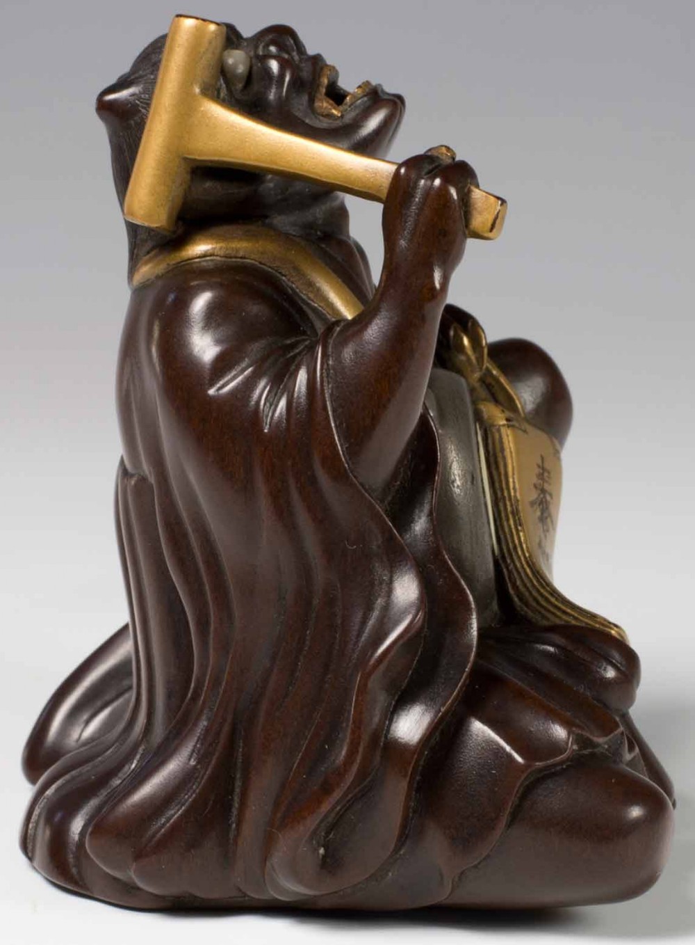A FINELY CARVED JAPANESE HARDWOOD AND GOLD LACQUER ONI OKIMONO View IV