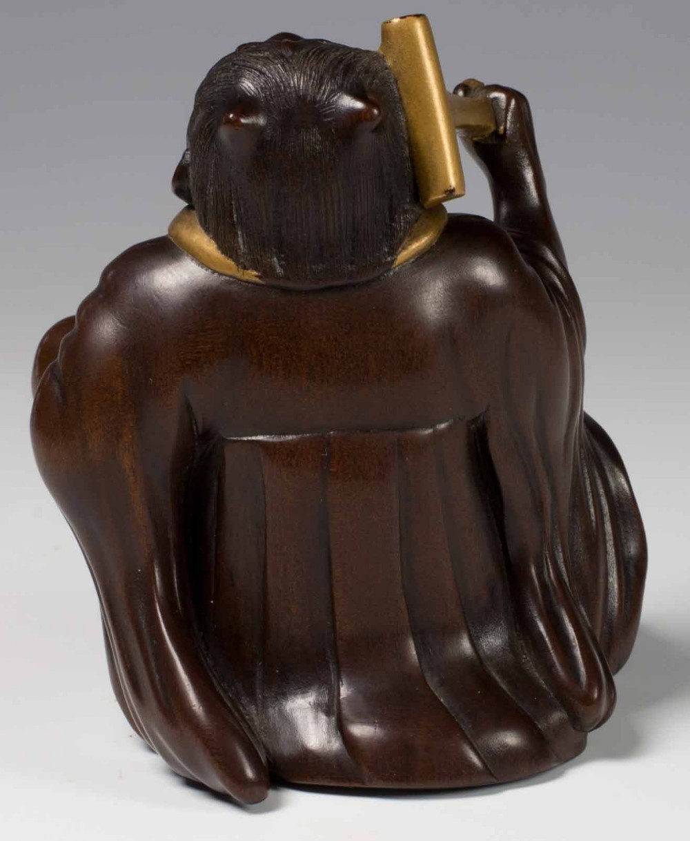 A FINELY CARVED JAPANESE HARDWOOD AND GOLD LACQUER ONI OKIMONO View VI