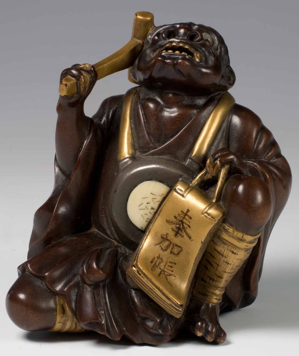 A FINELY CARVED JAPANESE HARDWOOD AND GOLD LACQUER ONI OKIMONO View VII