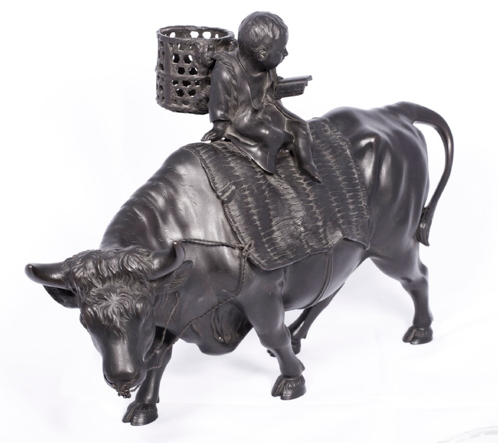 LARGE JAPANESE BRONZE OKIMONO OF A BOY SEATED UPON AN OXEN View II