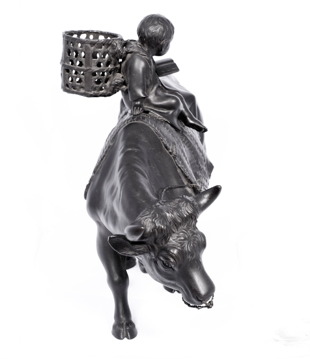 LARGE JAPANESE BRONZE OKIMONO OF A BOY SEATED UPON AN OXEN View III