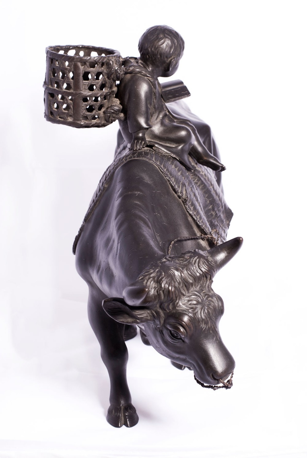 LARGE JAPANESE BRONZE OKIMONO OF A BOY SEATED UPON AN OXEN View IV