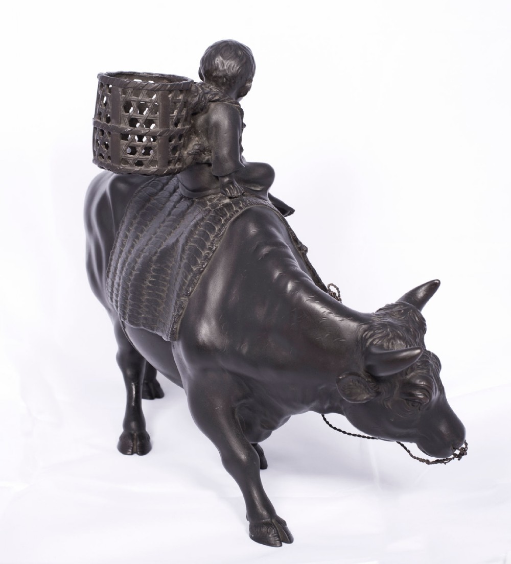 LARGE JAPANESE BRONZE OKIMONO OF A BOY SEATED UPON AN OXEN View V