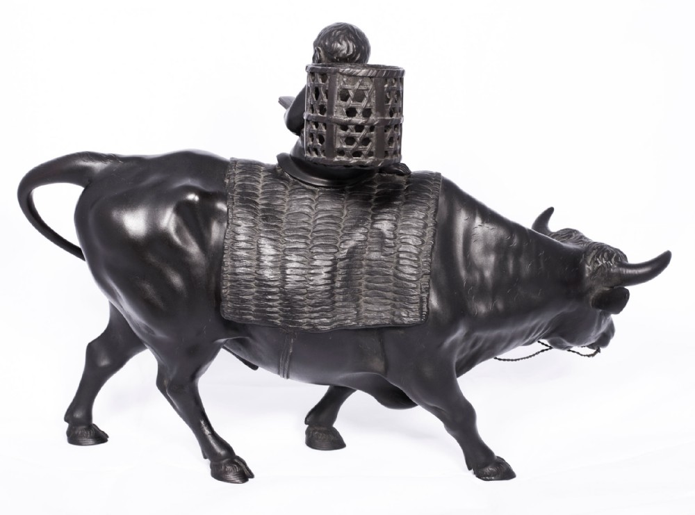 LARGE JAPANESE BRONZE OKIMONO OF A BOY SEATED UPON AN OXEN View VI