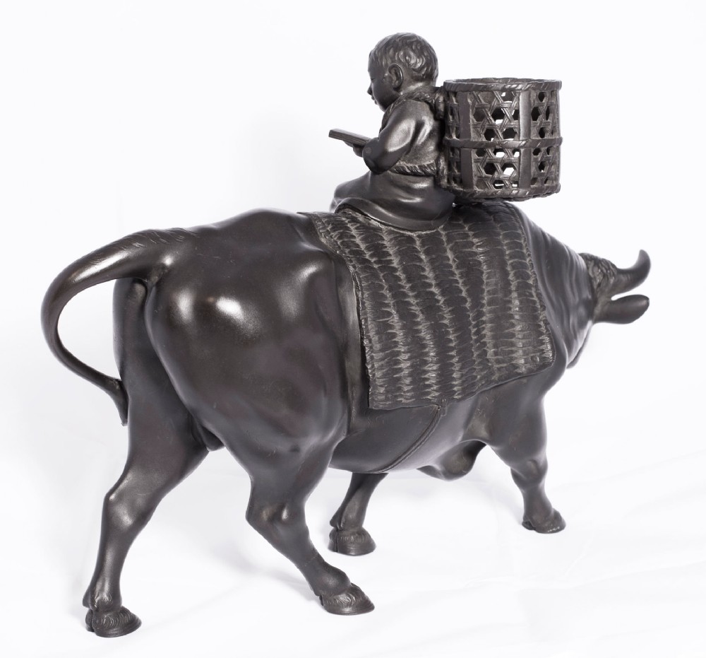 LARGE JAPANESE BRONZE OKIMONO OF A BOY SEATED UPON AN OXEN View VII