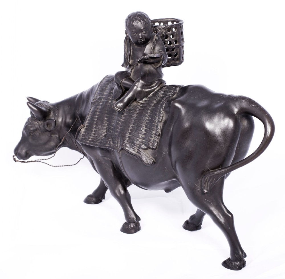 LARGE JAPANESE BRONZE OKIMONO OF A BOY SEATED UPON AN OXEN View X