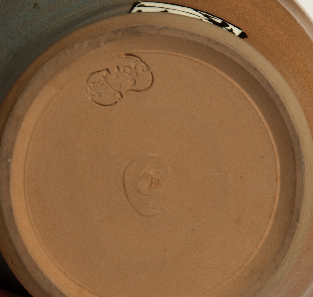 A Japanese ceramic vase featuring an overhead handle, decorated with a painted kingfisher bird on a branch over a tan and grey glazed body. View V