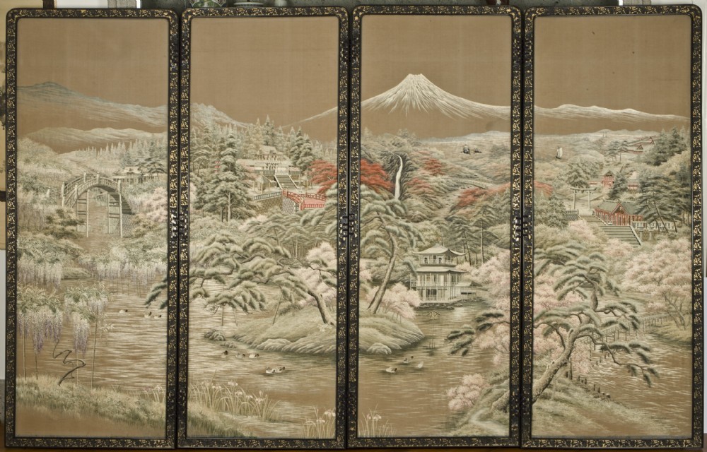 A four-panel Japanese folding screen featuring hand-embroidered landscape imagery with Mount Fuji set inside a black lacquered frame. View VI