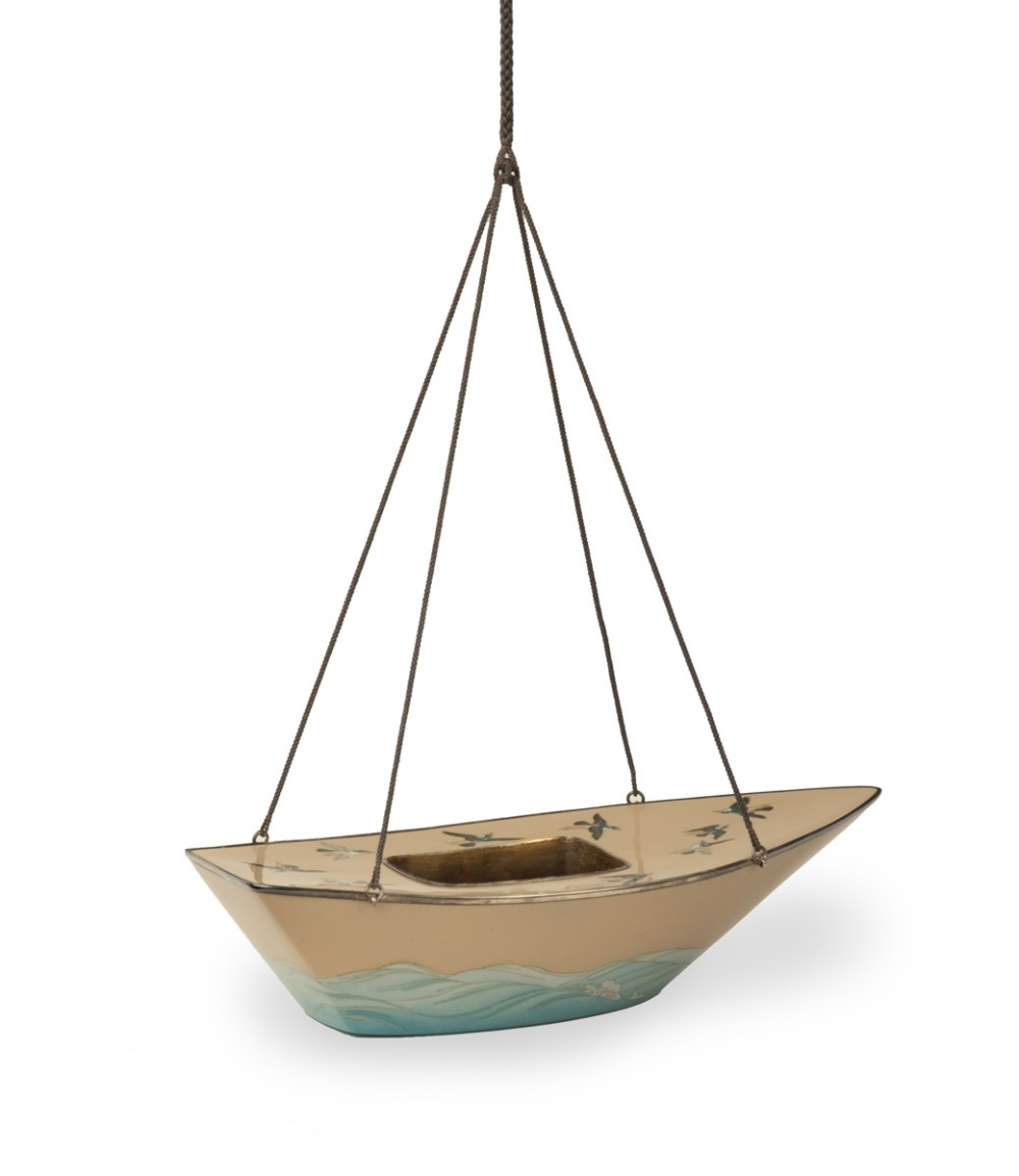 A boat-shaped Japanese cloisonne enamel hanging incense burner featuring flying bird motifs against a cream backdrop with wave details along the base, suspended by braided cords. View IV