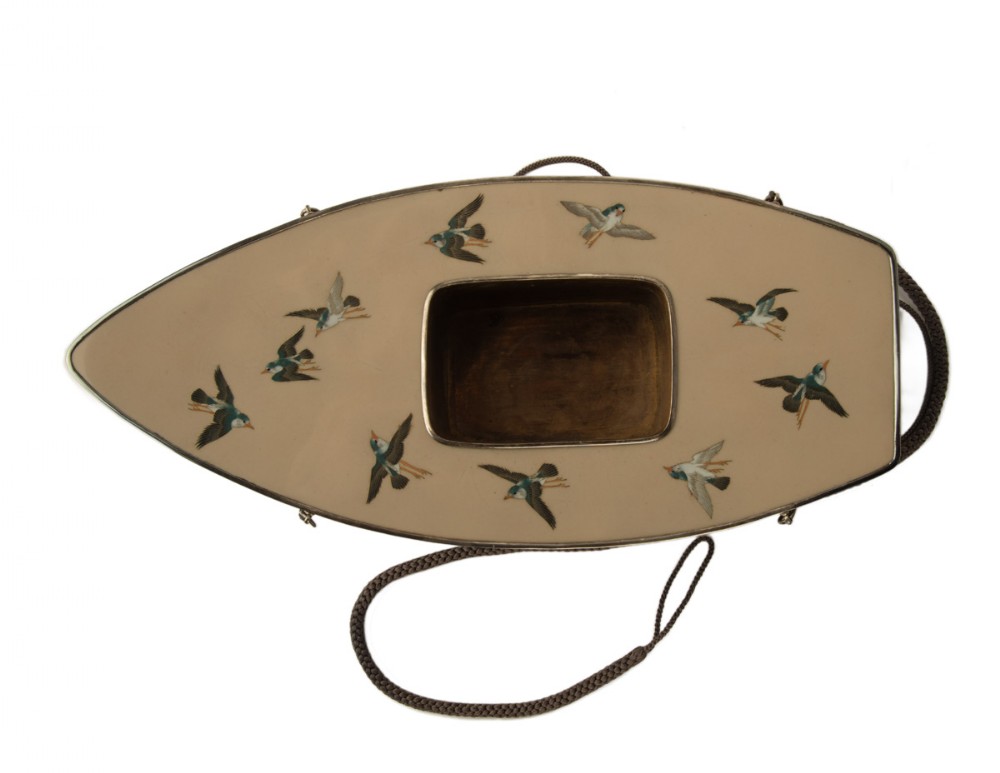 A boat-shaped Japanese cloisonne enamel hanging incense burner featuring flying bird motifs against a cream backdrop with wave details along the base, suspended by braided cords. View VII