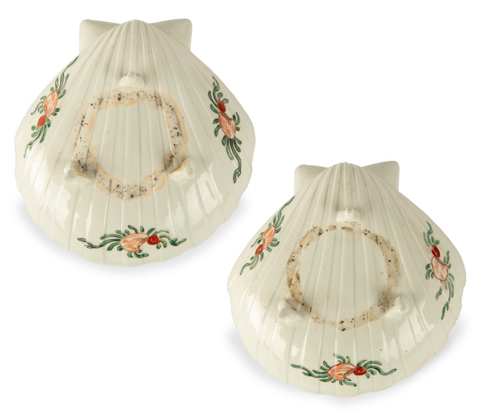 A pair of Japanese Edo period porcelain dishes moulded in the shape of clam shells with hand-painted green and red botanical enamel decorations on a cream ground. View III