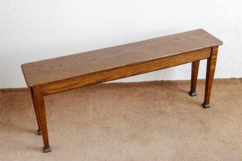AN ATTRACTIVE AND UNUSUAL ARTS AND CRAFTS OAK BENCH - ADDITIONAL PHOTO 1
