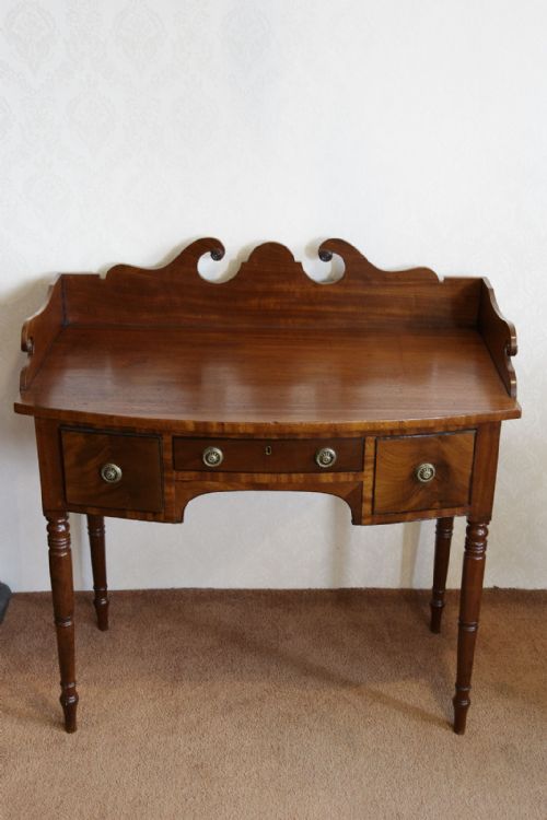 bowfront side table with three drawers - CATEGORY: ANTIQUE TABLES - DATED 19TH CENTURY