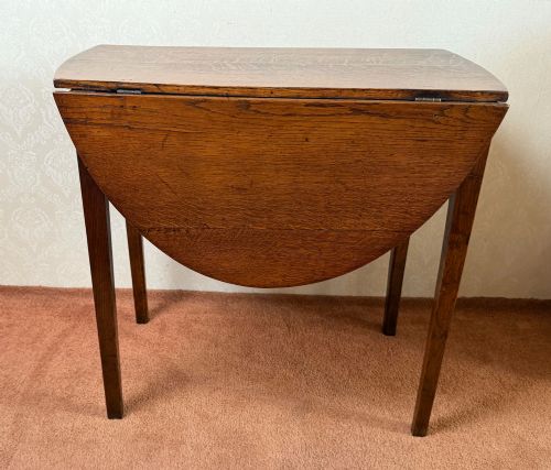 Oak Oval Drop Leaf Table with Finely Figured Timbers.