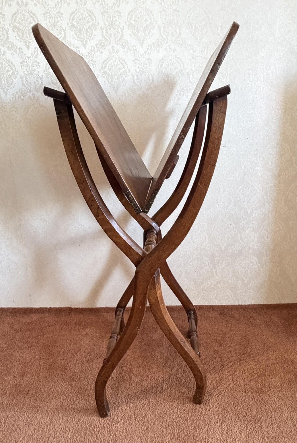 A warm brown wooden antique coaching table featuring a hinged rectangular top supported by curved X-frame legs and turned stretchers. View IV