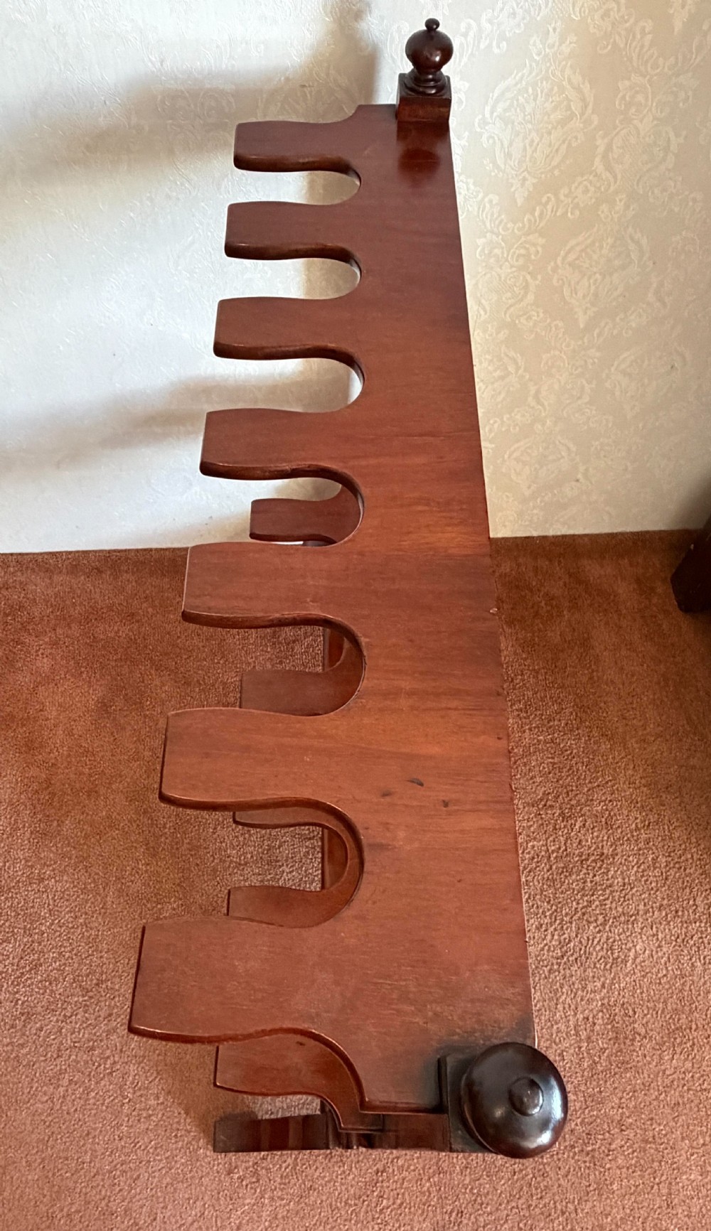 A mahogany wooden boot and whip stand featuring two notched horizontal tiers, top finials, and a lower shelf on curved feet. View IV