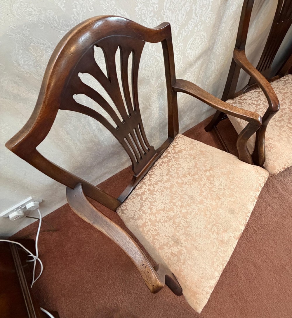 A pair of mahogany Hepplewhite style armchairs featuring carved pierced splats and patterned upholstered drop-in seats. View III