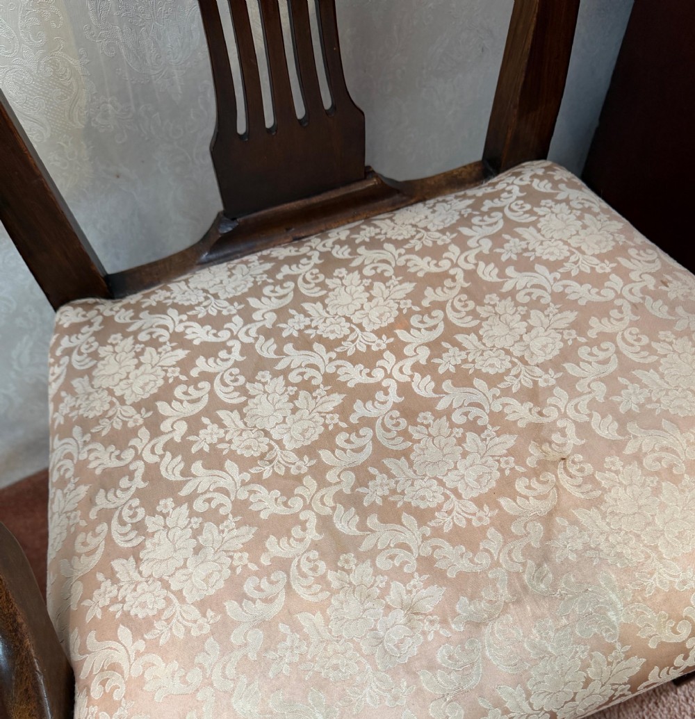A pair of mahogany Hepplewhite style armchairs featuring carved pierced splats and patterned upholstered drop-in seats. View VI