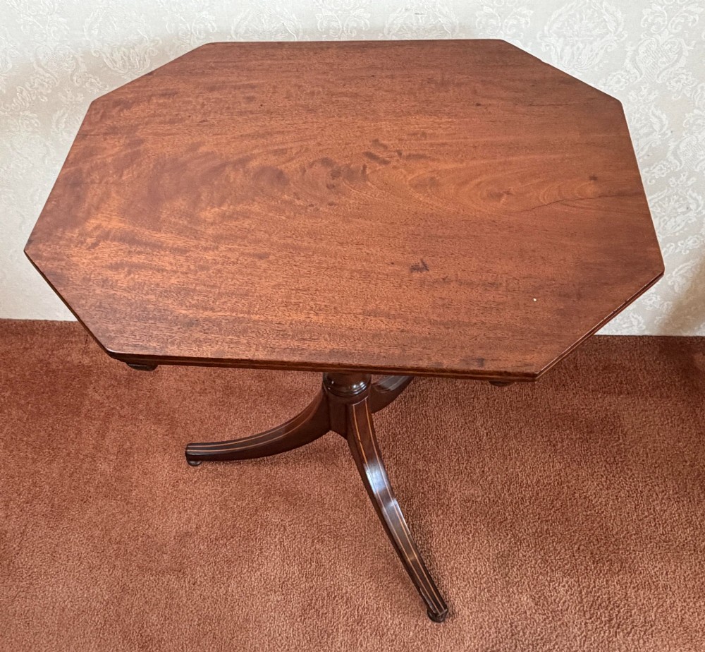 A mahogany tripod table featuring an octagonal top with boxwood line inlay along the edge and down the three splayed legs. View II