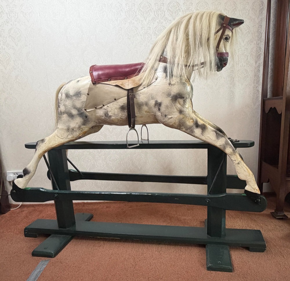 19TH CENTURY CARVED WOODEN ROCKING HORSE ON ITS ORIGINAL ROCKER