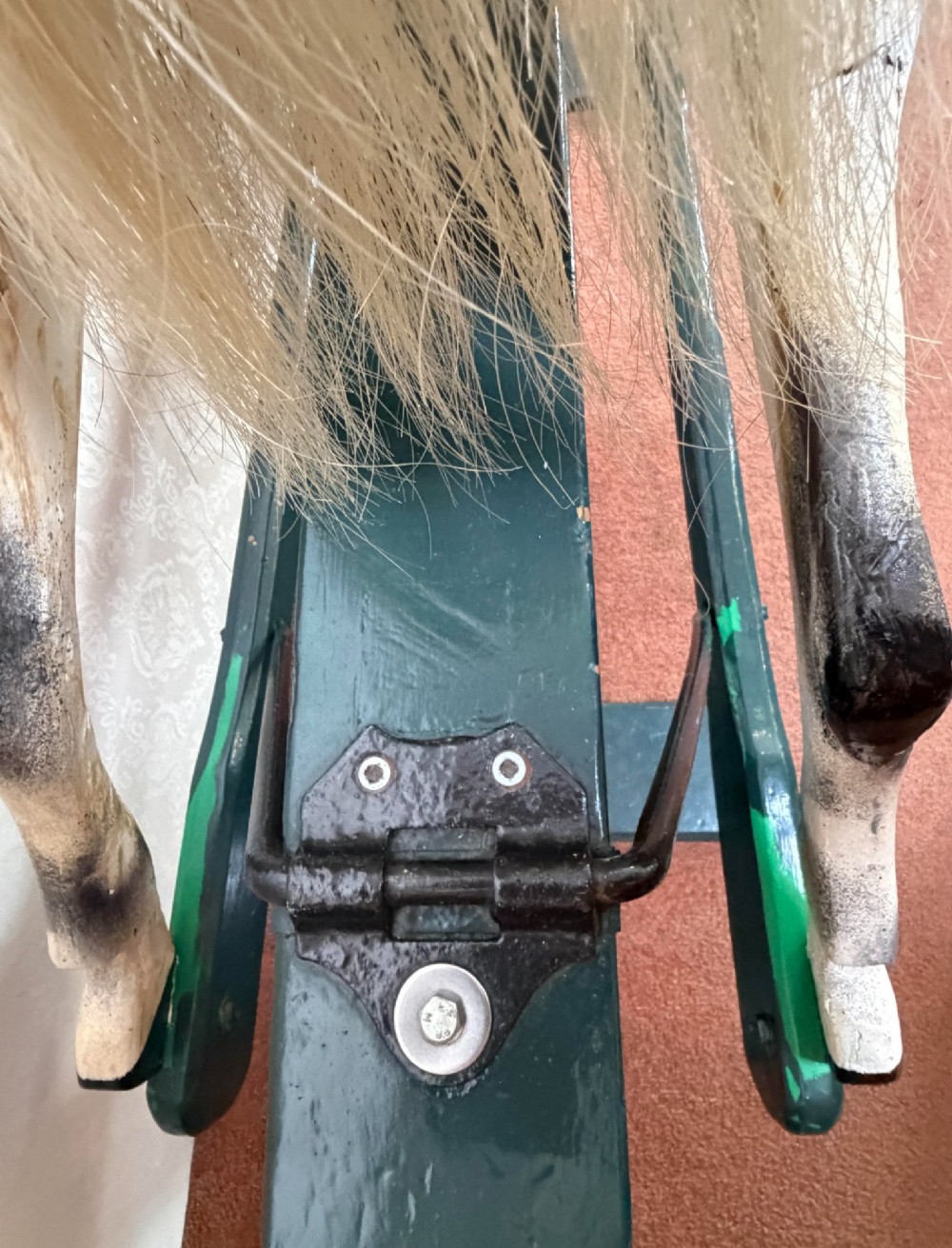 A 19th-century carved wooden dappled grey rocking horse with a leather saddle, horsehair mane, and dark green painted glider stand. View VI