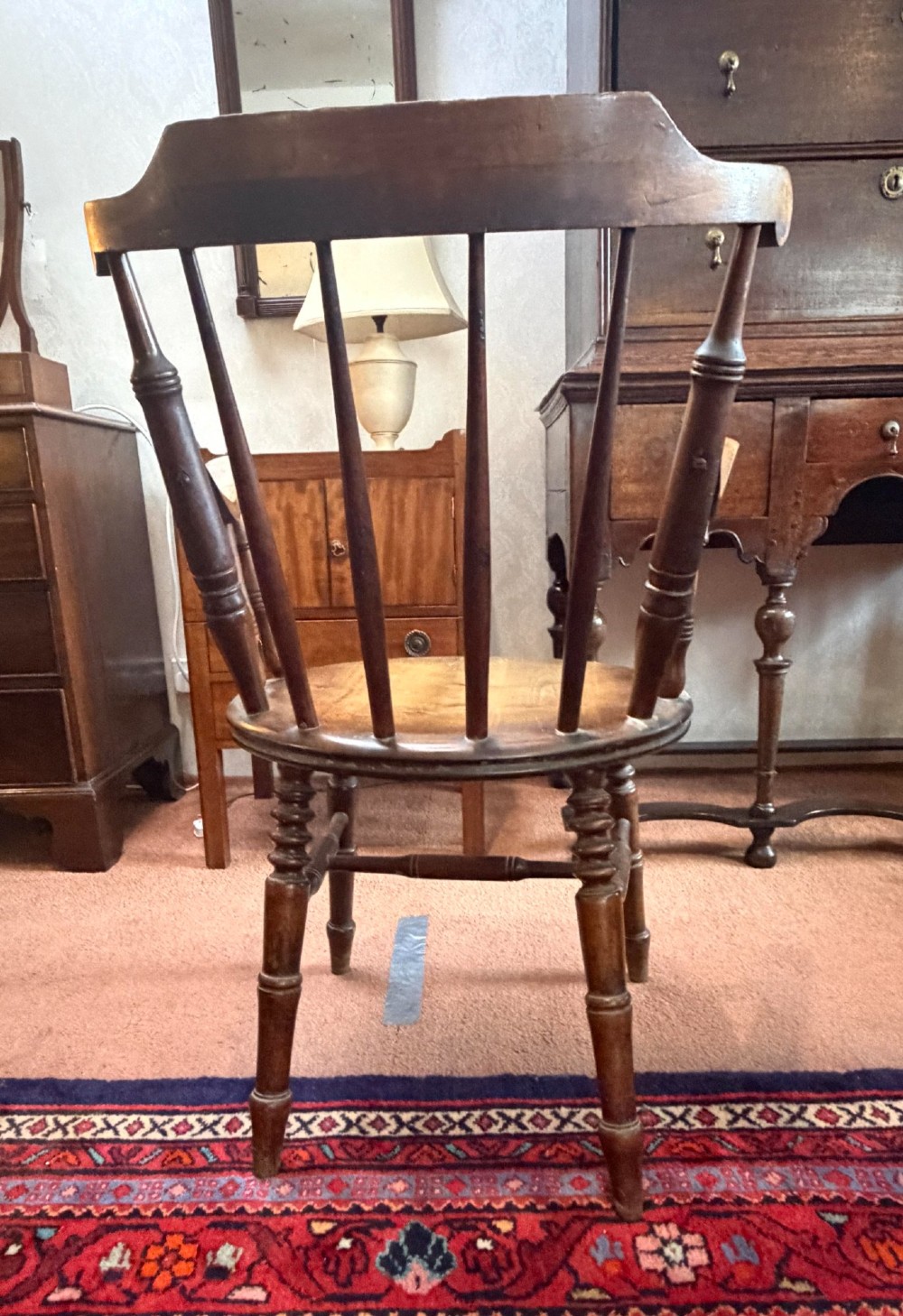 A Victorian ash wooden desk chair featuring turned legs, a contoured seat, curved armrests, and a spindle backrest. View V