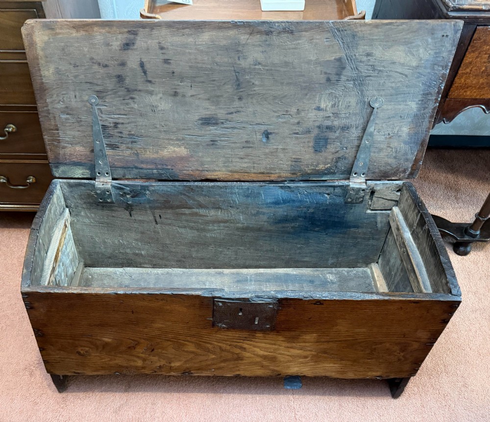 A dark oak antique plank sword chest featuring a central iron lockplate and bootjack end supports. View III