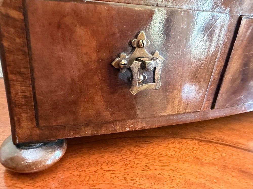 An early nineteenth-century mahogany box dressing mirror with a rectangular adjustable frame set above three drawers on small ball feet. View VII