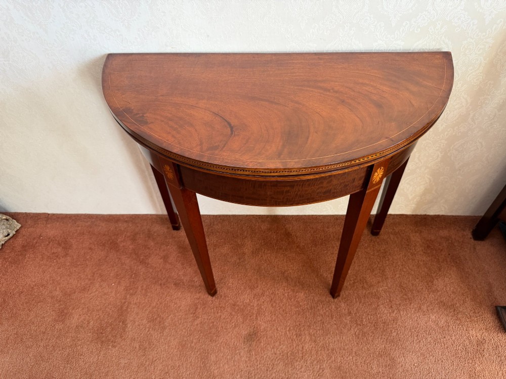An 18th-century mahogany demi-lune card table featuring tapered legs, inlaid satinwood stringing, and a hinged fold-over top. View III