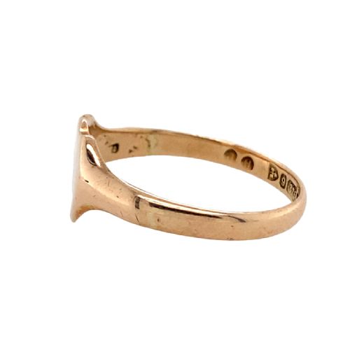 fig 1. An antique 9ct rose gold signet ring featuring a plain, unengraved shield-shaped top section.