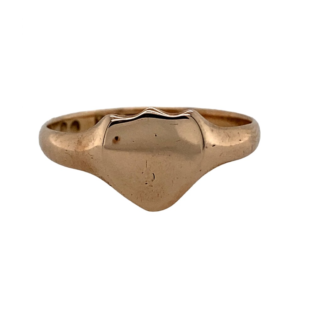 An antique 9ct rose gold signet ring featuring a plain, unengraved shield-shaped top section.