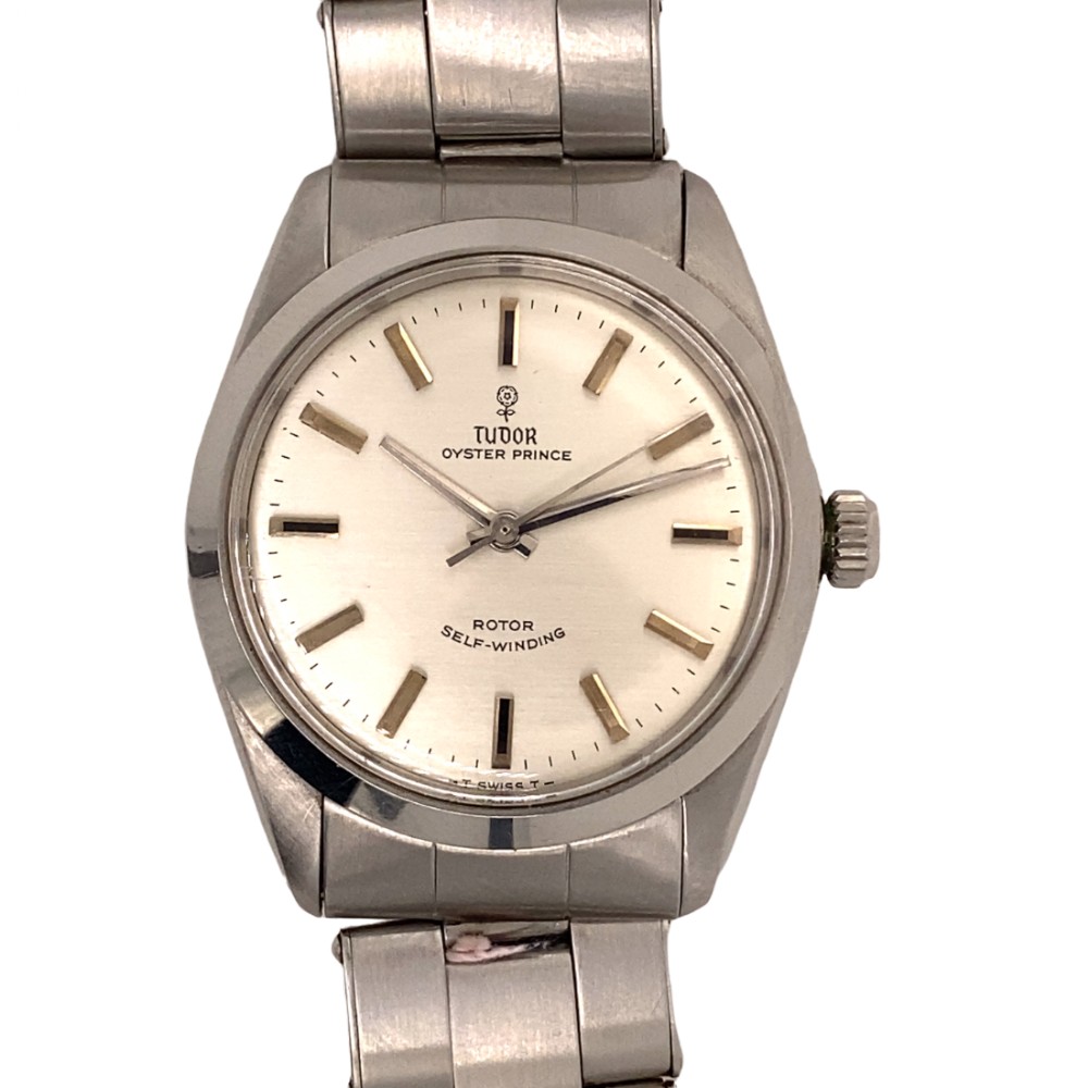 A stainless steel Tudor Oyster Prince automatic wristwatch featuring a silver dial and metal bracelet.