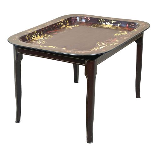 fig 1. A nineteenth-century dark lacquered papier-mache tray with gold floral decoration resting on a fitted dark wood stand with slender tapered legs.